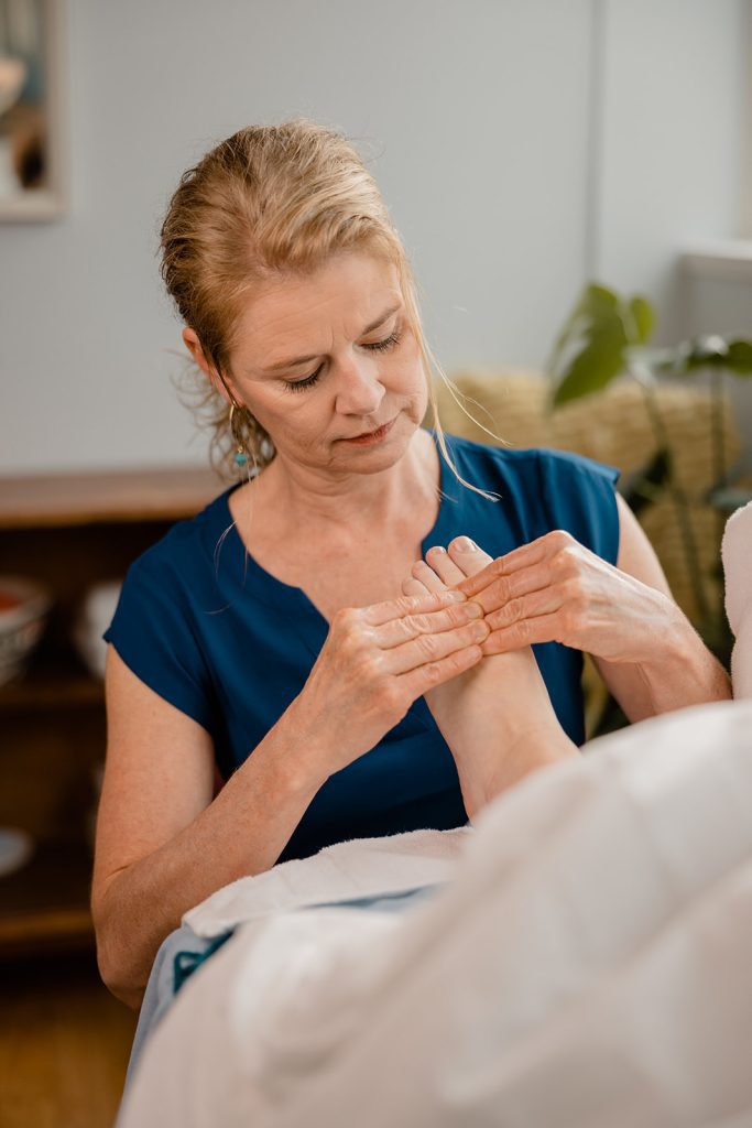 Michele Mork demonstrates reflexology foot sequence.